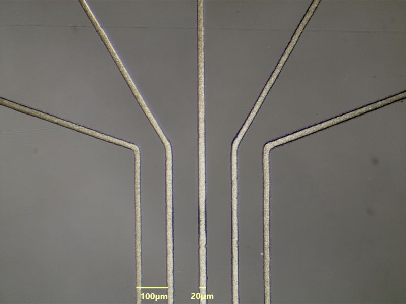 Micrograph of 20 micron NanoJet aerosol printed traces on temperature sensitive polycarbonate substrate