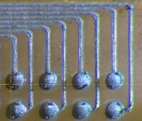 micrograph of printed silver interconnects and pads