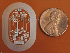 NanoJet printed biomedical device on Kapton polyimide. Shown next to a penny for scale